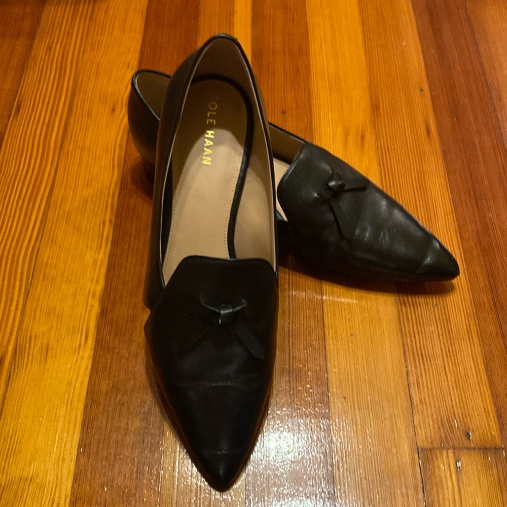 Cole Haan Vanya black leather flats loafers with cutout and tassel accent